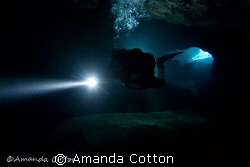Technical Diving. Cave diver entering into the no light z... by Amanda Cotton 